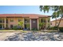 Exterior of a well-maintained two-story condo building with ample parking at 4325 46Th W Ave # 203, Bradenton, FL 34210