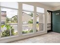Bright and inviting living room features large windows providing natural light and views of the neighborhood at 4475 Sandner Dr, Sarasota, FL 34243
