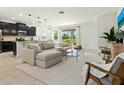 Open-concept living area featuring a comfortable sectional sofa and abundant natural light at 4615 73Rd E St, Bradenton, FL 34203