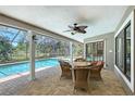 Inviting outdoor patio with screened in pool and lush landscaping, perfect for entertaining at 4917 Leatha Ln, Sarasota, FL 34232