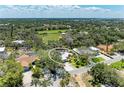 Aerial view of the property nestled among lush greenery and landscaping in a quiet neighborhood at 5223 Shadow Lawn Dr, Sarasota, FL 34242