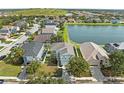 Scenic aerial view of homes on a lake, offering peaceful waterfront living in a tranquil community at 5224 58Th E Ter, Bradenton, FL 34203