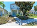 Charming two-story home featuring a manicured lawn and inviting front porch at 5420 River Sound Ter, Bradenton, FL 34208