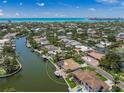 Waterfront property with a private dock and pool, nestled in a serene neighborhood at 572 Commonwealth Ln, Sarasota, FL 34242