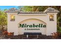 Attractive entrance sign for Mirabella, A Condominium, set amidst lush greenery and manicured landscaping at 600 Mirabella Cir # 201, Venice, FL 34292