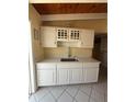Updated kitchen showcasing white cabinetry and new countertop at 6006 Midnight Pass Rd # 48, Sarasota, FL 34242