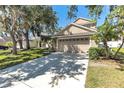 Home showcases a spacious driveway and an attached two-car garage at 6032 36Th E Ct, Ellenton, FL 34222