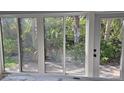 Sliding glass doors let in plenty of light and provide access to lush outdoor patio at 730 Spanish S Dr # 99, Longboat Key, FL 34228