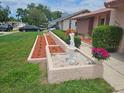 Charming single-story home with a well-manicured lawn and inviting curb appeal at 8040 Canterbury Cir, Seminole, FL 33777