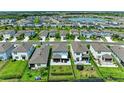 An aerial view of a neighborhood featuring fenced backyards and access to community amenities at 8940 Royal River Cir, Parrish, FL 34219