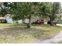 Modest single-story home with vehicles parked in the driveway at 104 22Nd Street E Ct, Bradenton, FL 34208