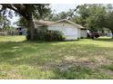 Quaint single-story home with a lush green lawn at 104 22Nd Street E Ct, Bradenton, FL 34208