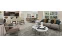 Open-concept living space combining kitchen, dining, and living areas for relaxed living and entertaining at 10821 Gentle Current Way, Parrish, FL 34219