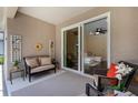 Relaxing screened patio with cozy seating and a view into the living area at 11794 Forest Park Cir, Bradenton, FL 34211