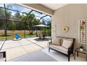 Inviting screened-in patio with comfortable seating and an outdoor dining area at 11794 Forest Park Cir, Bradenton, FL 34211