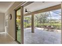 Spacious screened-in patio featuring neutral tile flooring and comfortable outdoor seating for relaxing at 12908 Crystal Clear Pl, Bradenton, FL 34211