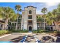 Beautiful condo exterior with palm trees and accessible entrance at 17118 Vardon Ter # 404, Bradenton, FL 34211