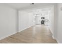 Bright living room featuring hardwood floors and an open view to the modern kitchen at 2652 26Th St, Sarasota, FL 34234