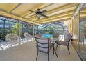 Covered patio with dining area, ideal for outdoor entertaining overlooking the pool at 2702 45Th S St, Gulfport, FL 33711