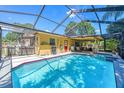 Sparkling pool with screened enclosure, perfect for outdoor enjoyment at 2702 45Th S St, Gulfport, FL 33711