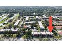 Aerial view of condo complex with mature trees and well-maintained landscaping at 3253 Beneva Rd # 103, Sarasota, FL 34232