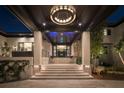 Elegant front entrance features stone accents, steps leading to the dark wood ceiling with a chandelier at 3799 Flamingo Ave, Sarasota, FL 34242