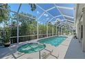 Inviting screened-in pool and spa with a patio perfect for outdoor relaxation and entertaining at 4603 4Th E Ave, Bradenton, FL 34208