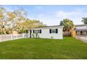 Well-maintained home featuring a lovely yard, inviting entrance, and clean lines at 5045 10Th S Ave, Gulfport, FL 33707