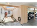 The carport leads to a bright entryway with courtyard, adding charm and natural light at 5062 White Oak Ct, Bradenton, FL 34207