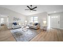 Inviting living room with wood floors, stylish decor, and a bright, airy atmosphere at 5125 Palm Aire Dr, Sarasota, FL 34243