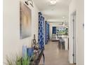 Bright entryway with decor and neutral color palette, leading to the living area, creating an inviting atmosphere at 5358 Shell Mound Cir, Punta Gorda, FL 33982