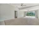 Spacious living room boasts neutral carpet, recessed lighting and access to the lanai and other rooms at 5566 Avellino Pl, Sarasota, FL 34238