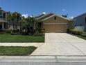 Well-maintained home boasts a long driveway and meticulously manicured landscaping at 6121 35Th E Ct, Bradenton, FL 34203