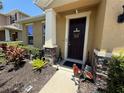 Inviting entrance with decorative stone accents and charming decorations to welcome guests at 6121 35Th E Ct, Bradenton, FL 34203