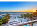 Spectacular beach view from the balcony overlooking the ocean, offering a serene escape at 6512 Midnight Pass Rd # 301, Sarasota, FL 34242