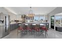 Spacious updated kitchen boasts stainless appliances and large island at 7160 Myakka Valley Trl, Sarasota, FL 34241