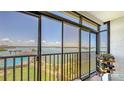 Relaxing screened lanai view overlooking the pool and Intracoastal waterway, perfect for enjoying the Florida scenery at 8897 Midnight Pass Rd # 407, Sarasota, FL 34242