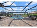 Relaxing pool and spa with an elegant lanai, perfect for entertaining friends and Gathering outdoors at 8982 Baroque Ter, Sarasota, FL 34240