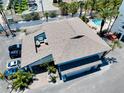Aerial view of building showing private rooftop patio and pool at 1001 Point Of Rocks Rd # 207, Sarasota, FL 34242