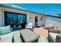 Spacious rooftop deck with lounge furniture offers a relaxing outdoor space with palm tree views at 1001 Point Of Rocks Rd # 207, Sarasota, FL 34242