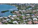 Aerial view of waterfront homes surrounded by beautiful landscaping and a canal at 1387 Harbor Dr, Sarasota, FL 34239