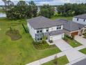 An aerial view of a two-story home with a big yard and a 2 car garage in a nice community at 14787 Gallop Run Dr, Lithia, FL 33547