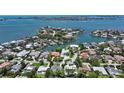 Aerial view showcasing waterfront property and neighborhood, with the featured home circled at 1607 Flower Dr, Sarasota, FL 34239