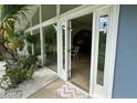 Inviting front entrance with a glass door and sidelights, showcasing the home's airy interior at 2159 Constitution Blvd, Sarasota, FL 34231