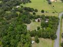 Aerial view showing the property and its proximity to open fields at 22063 Lake Lindsey Rd, Brooksville, FL 34601