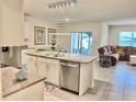 Modern kitchen with stainless steel appliances, granite countertops, and pendant lighting at 2410 Mizner Bay Ave, Bradenton, FL 34208