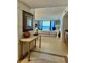 Inviting entryway leading to the living area with tile flooring and ocean view at 2675 Gulf Of Mexico Dr # 203, Longboat Key, FL 34228