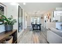 Open-concept living area with stylish decor, wood flooring, and lots of natural light creates a welcoming and modern atmosphere at 2801 21St W Ave, Bradenton, FL 34205