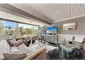 Relaxing living room with expansive windows, modern furnishings, and stylish decor at 33 S Gulfstream Ave # 306, Sarasota, FL 34236