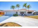 Charming single-story home with a well-manicured lawn, tile roof, and inviting curb appeal at 3426 Brookline Dr, Sarasota, FL 34239